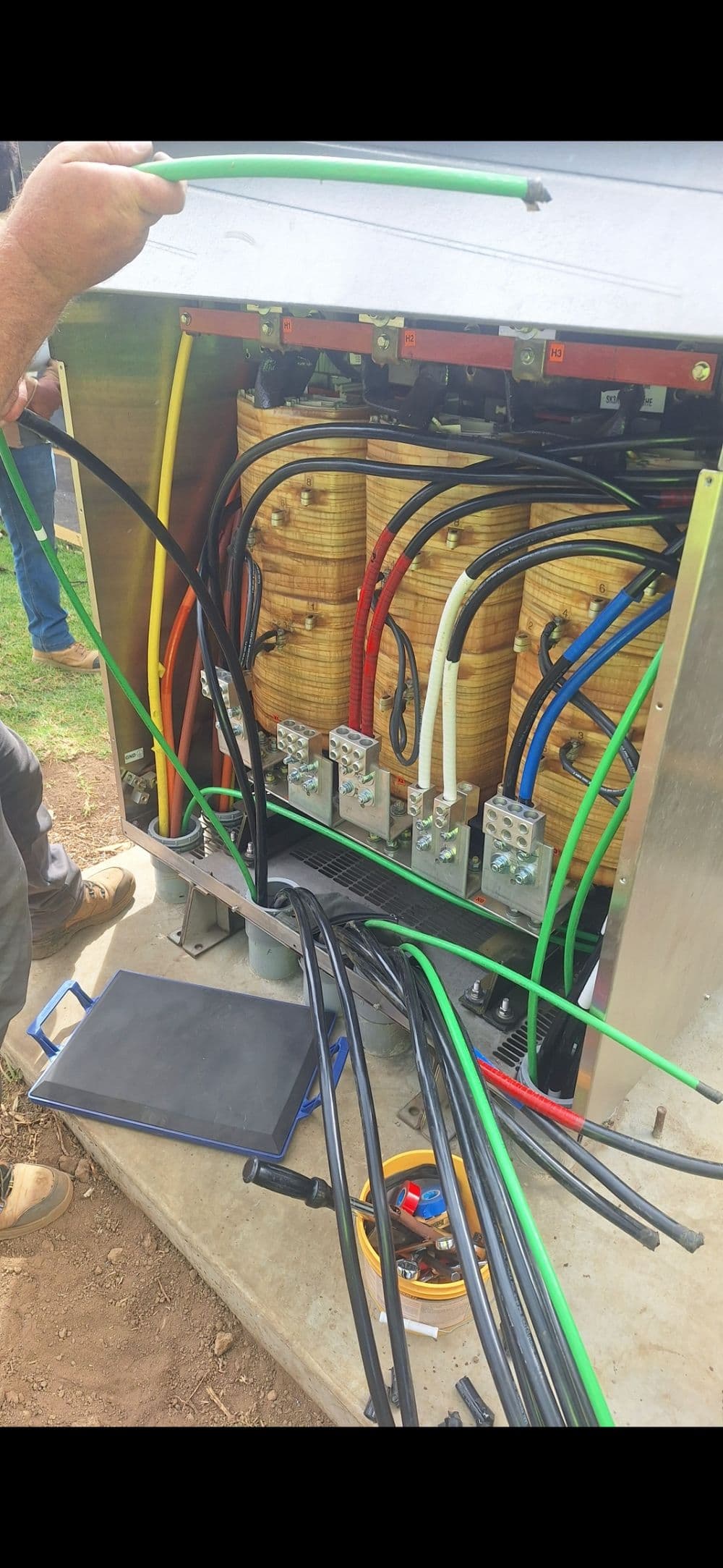 Electrical panel with colorful wiring and connectors during installation or maintenance.